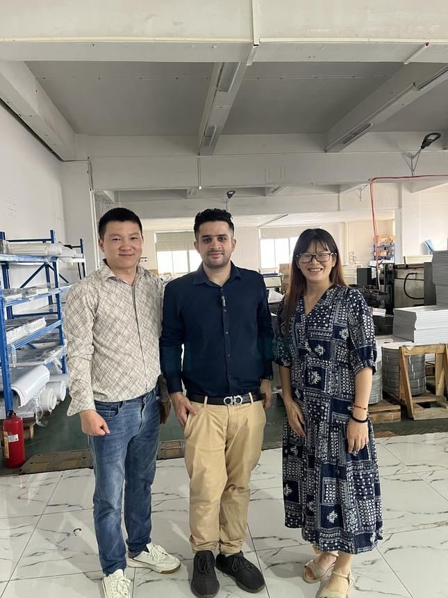 Our founder with a supplier's team inside their factory